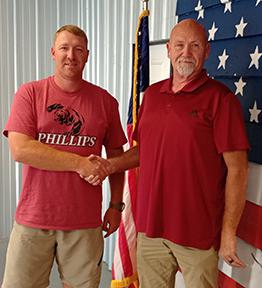 Adam Hyde, left, is welcomed to the Bear Creek Town Council by Mayor Rob Taylor.