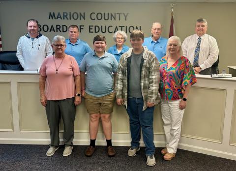 Shown with the MCBOE are, from left, Brilliant School representatives Crystal Nelson (teacher), Levi Norris (student), Richard Ross (student) and Dr. Kim Davis (principal), who showed appreciation to the BOE on April 25 for approving their recent trip to Italy, and presented a trip summary with photos. Photo by Marion County Schools Parent Community Liaison Angela Wilds.