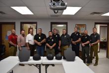 Marion County officials pose with new helmets and shields. From left are County Investigator Kevin Bryant, Assistant EMA Director Blake Farley, Sheriff Kevin Williams, Winfield Police Chief Brett Burleson, Brilliant Police Chief Eddie Bryant, Winfield Assistant Chief Gary Hamlett, Hackleburg Police Chief Kenny Hallmark, Guin Police Chief Daryl Spencer, Hamilton Police Lieutenant Scotty Chandler and Hamilton Police Chief Jordan Carter. 
