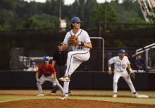 Logan Samuels winds up to pitch during his time at the University of Montevallo