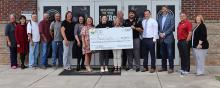 Shown from left are grant recipients and Northwest RC&D officials. They are Ginger Eatman, SNAP-Ed regional Extension agent; Ann West, Marion County Schools superintendent; Don Barnwell, RC&D board member and Hackleburg councilor; Kenneth Cochran, Marion County Commission; Ray Cantrell, with Craft Volunteer Fire Department; Carla Lewis with Marion County Extension; Vanessa King, operation manager at NWRC&D; Gina Bryant with Winfield Park and Recreation; Anna Morrison, NWRC&D outreach coordinator; Lauranne J