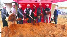 Winfield City Councilman Larry Reese Sr. joins Eric Corti, project manager (Structure First); Mark Hightower, VP of retail (Listerhill); Brad Green, president/CEO (Listerhill); Alanna Sullivan, chief operations strategist (Listerhill); Dale Hayes, VP of facilities (Listerhill); Justin Vandiver, owner (Smith General); and Jim “Scooby” Bilinsky, superintendent (Smith General) to break ground on the new branch coming to Winfield. 