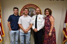 New Hamilton Fire Department Assistant Chief Eric Lynch is shown with his family, wife Erica, and twin sons Hunter (far left) and Hayden.