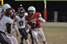 Marion County’s Tye Madison (#7) rushes for several yards on a carry during the fourth quarter.